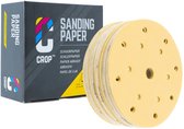 CROP schuurpapier schijven, 150mm, korrel 120. De gele schijven hebben 15 gaten. Een grijze doos met CROP logo staat naast de schijven.