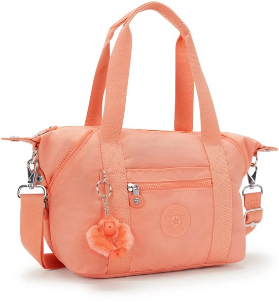 Licht oranje Kipling handtas met bovenhandvatten en een schouderband.