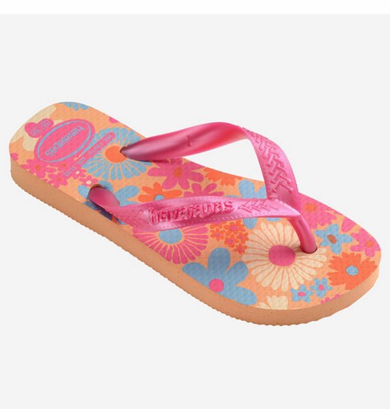 Tongs Havaianas roses avec imprimé floral et semelle orange, brides roses brillantes.
