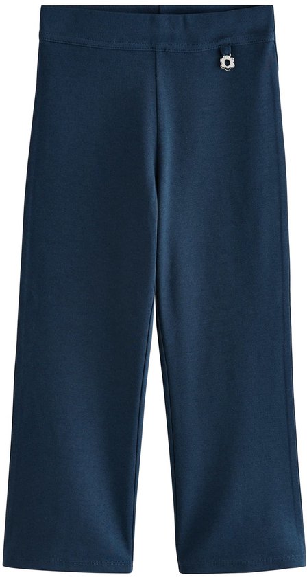 Donkerblauwe, wijde broek met elastische tailleband en klein bloemdetail op de heup.