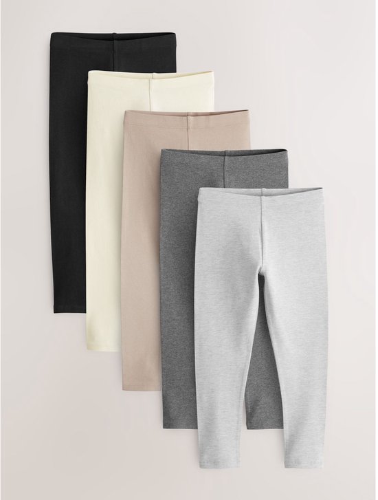 Vijf leggings in zwart, gebroken wit, lichtbruin, grijs en lichtgrijs.