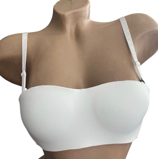 Witte strapless bh met geribbelde stof en VICTORIA'S SECRET tekst op de bandjes.