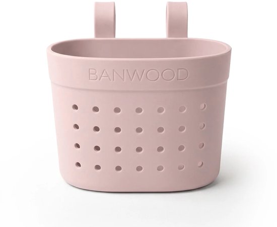 Roze mandje van Banwood met gaatjespatroon en handvatten om aan een step of fiets te bevestigen.