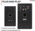 Achterkanten van twee zwarte boekenplank speakers met aansluitingen en tekst 'PLUG-AND-PLAY'.