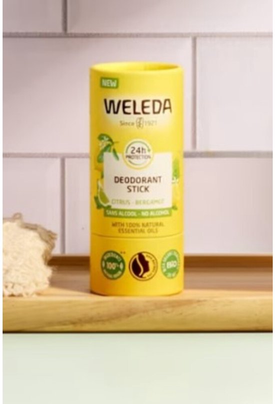 Gele deodorantstick met citrus en bergamot, verpakt in karton met 'NEW' en '24h PROTECTION' logo.