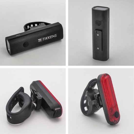 Lampes de vélo noires Tikkens: feu avant, feu arrière et clips de fixation, sur fond gris.