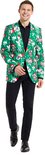 Man in groene blazer met kerstprint van lama's en sneeuwvlokken, met rode kerstmuts.