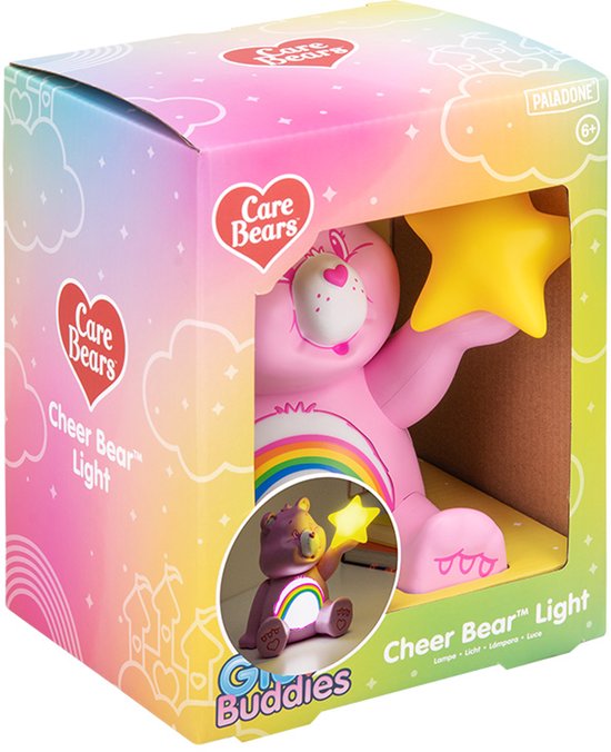 Veilleuse Cheer Bear rose dans une boîte colorée, avec un arc-en-ciel et une étoile.
