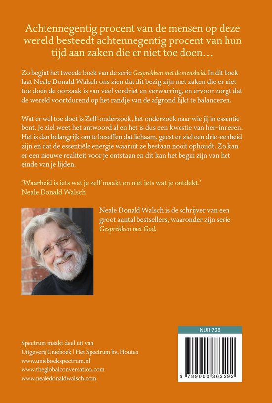 Portret van Neale Donald Walsch met een grijze baard en krullend haar, lachend, met een bril.