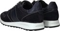 Achterkant van donkerblauwe PME Legend sneakers met witte stiksels en een witte zool.
