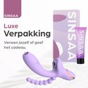 Paarse vibrator en paarse giftbox met gouden accenten. "Luxe Verpakking".