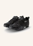 Paire de chaussures de vélo noires avec fermeture velcro, lacets et logo VAUDE.