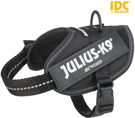 Zwart IDC-harnas met reflecterende strepen en 'JULIUS-K9 IDCPOWER'-logo.