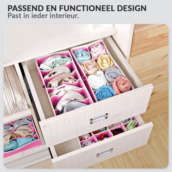 Roze opbergdozen gevuld met opgerolde kleding zoals bh's, sokken en ondergoed, in een ladekast.