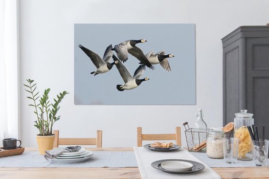 Quatre oies dans l'air Toile 120x80 cm - Tirage photo sur toile (Décoration murale salon / chambre) / Peintures sur toile Animaux