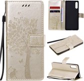 Voor Sony Xperia L4 Tree & Cat reliÃ«fpatroon Horizontale flip lederen tas met houder & kaartsleuven & portemonnee en lanyard (goud)