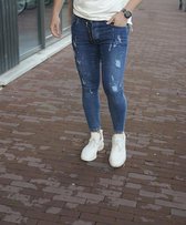 RYMN Jeans skinny donkerblauw met oranje en witte verfvlekken