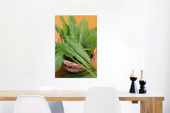 Feuilles d'oseille dans un petit panier en osier Toile 60x90 cm - Tirage photo sur toile (Décoration murale salon / chambre)