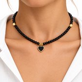 Zwarte kralen ketting dames minimalistische kralen ketting met hartje hanger zwarte kralen ketting verstelbare ketting goudkleurige details elegante fashion sieraden