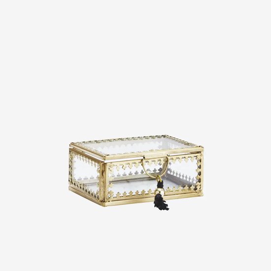 Glazen sieraden doosje met messing randen en een zwart kwastje aan de voorkant.