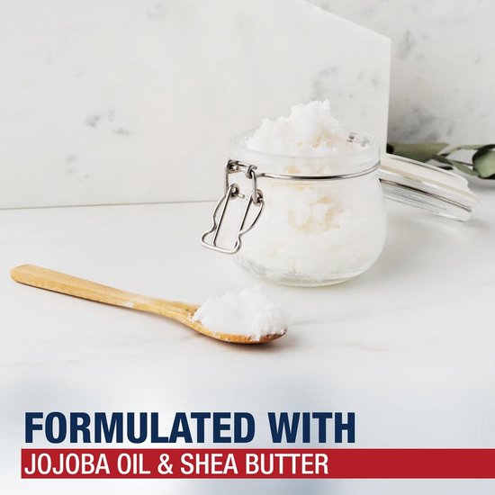 Glazen potje met witte balsem en houten lepel. Tekst: Geformuleerd met jojoba-olie en sheaboter.