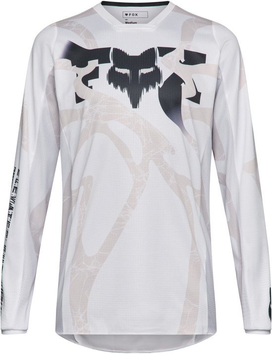 Wit Fox 180 motocross-shirt met abstract beige patroon en zwarte Fox-graphic op de borst.