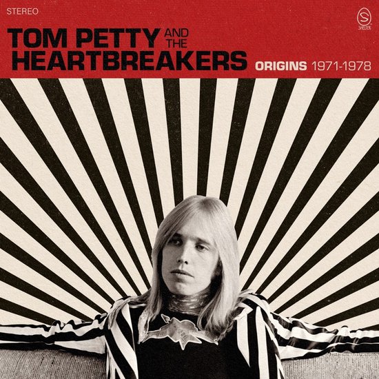 Tom Petty and the Heartbreakers Origins 1971-1978 albumcover met Tom Petty met blonde haren, gekleed in een gestreept jasje.
