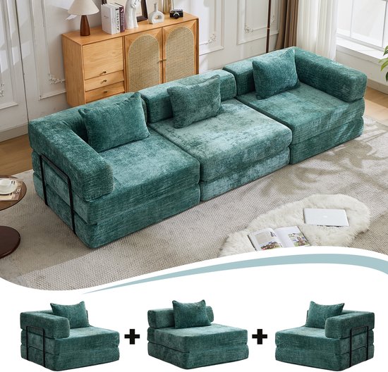 Donkergroene modulaire bank, met op de achtergrond twee fauteuils en een tussenstuk die de bank kunnen vormen.