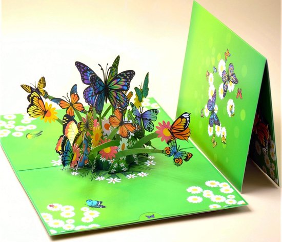 3D-wenskaart met pop-up van kleurrijke vlinders en madeliefjes op een felgroene achtergrond.