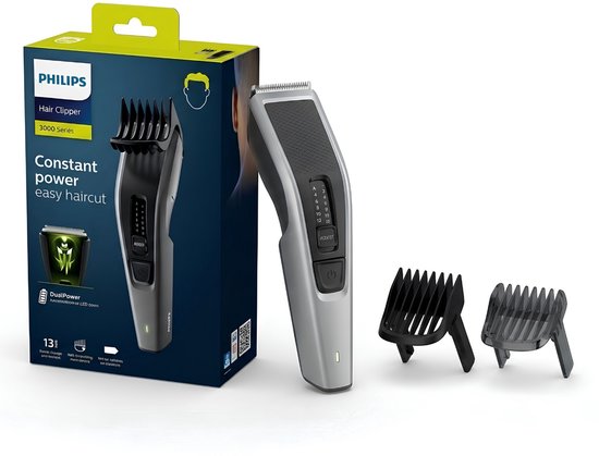 Zilverkleurige Philips 3000-serie tondeuse met twee opzetkammen en verpakking met tekst 'Constant power easy haircut'.