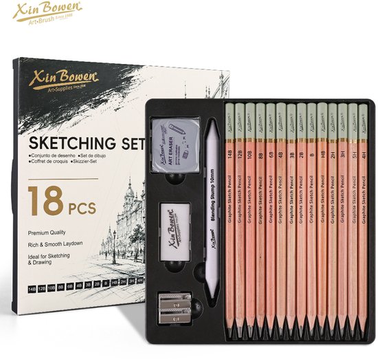 Un set de croquis de 18 pièces comprenant des crayons graphite, un estompeur, une gomme et un taille-crayon dans une boîte ouverte.