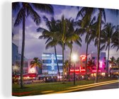 Canvas Schilderij Verlichte Ocean Drive in Miami bij avond - 60x40 cm - Wanddecoratie