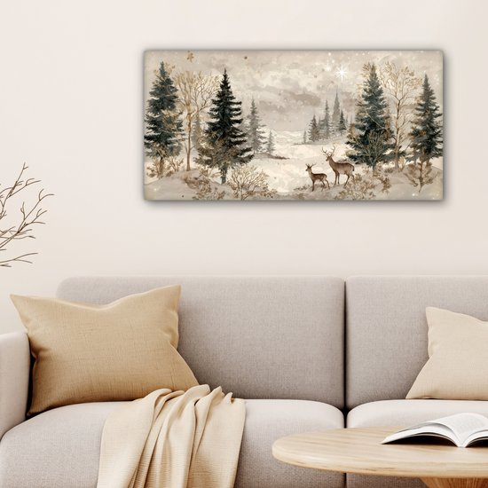 Paysage forestier hivernal avec deux cerfs et des accents dorés, suspendu au-dessus d'un canapé.