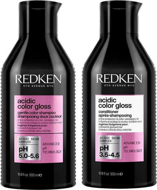 Deux bouteilles noires de shampooing et revitalisant Redken Acidic Color Gloss, avec des étiquettes roses. Le shampooing est pour pH 5.0-5.6, le revitalisant pour pH 3.5-4.5.