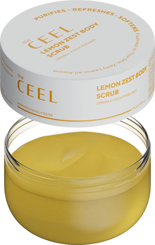 Een open potje met gele bodyscrub. Op de deksel staat 'Purifies - Refreshes - Softens'.