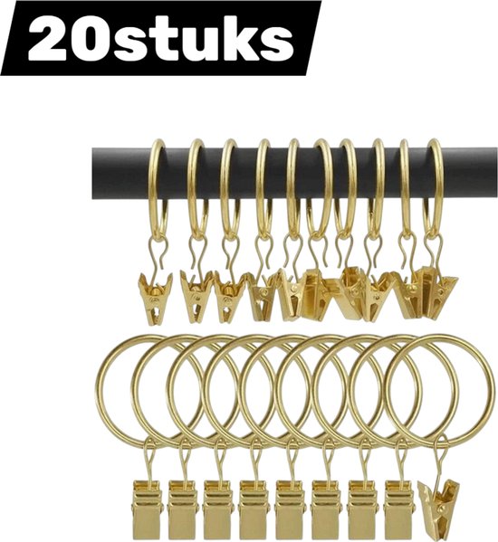 Anneaux de rideaux dorés avec clips sur une tringle, et une pile d'anneaux avec clips. Texte '20stuks' visible.