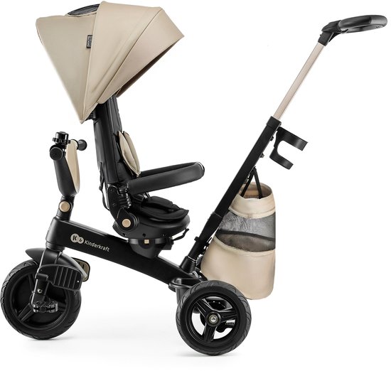 Zijprofiel van beige driewieler met zwarte en gouden accenten, verstelbare duwstang en opbergmand.