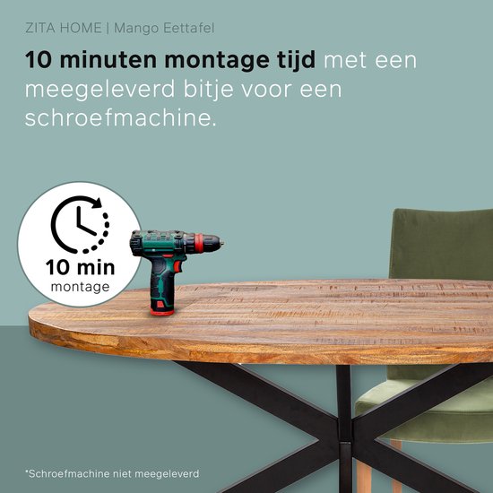Houten eettafel met een rond tafelblad en een stervormig zwart metalen onderstel, met een boormachine en een stoel.