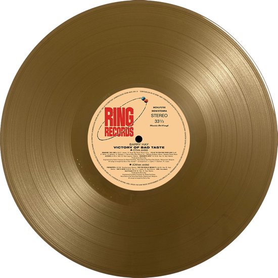 Gouden vinylplaat met 'RING RECORDS' label en 'VICTORY OF BAD TASTE' tekst.