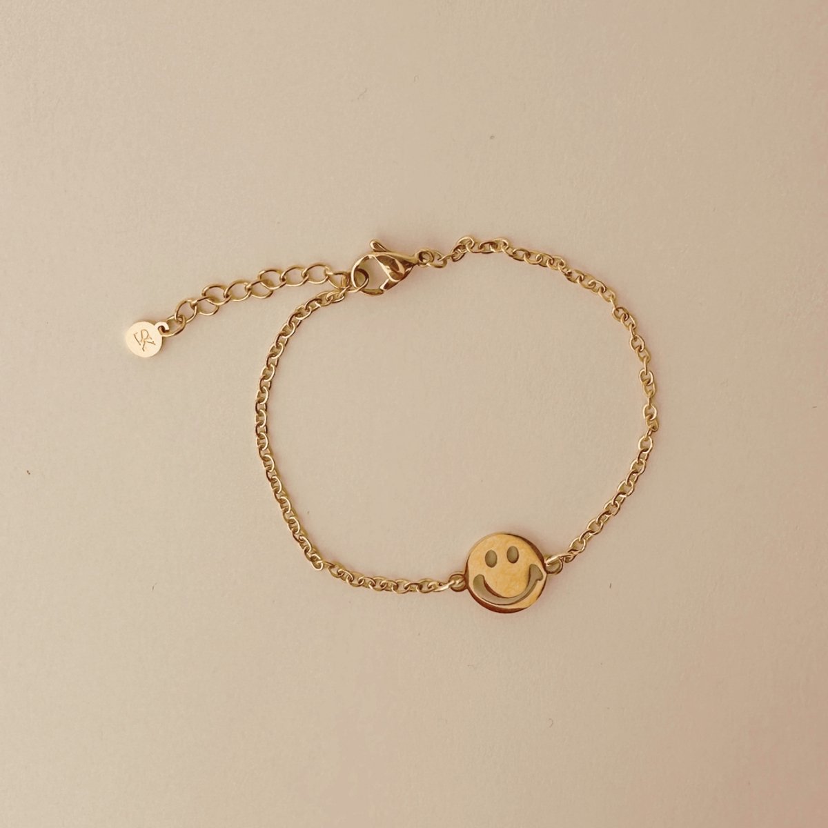 Armband goudkleurig – Smiley bedel – Stainless steel dames armband – SK Sieraden