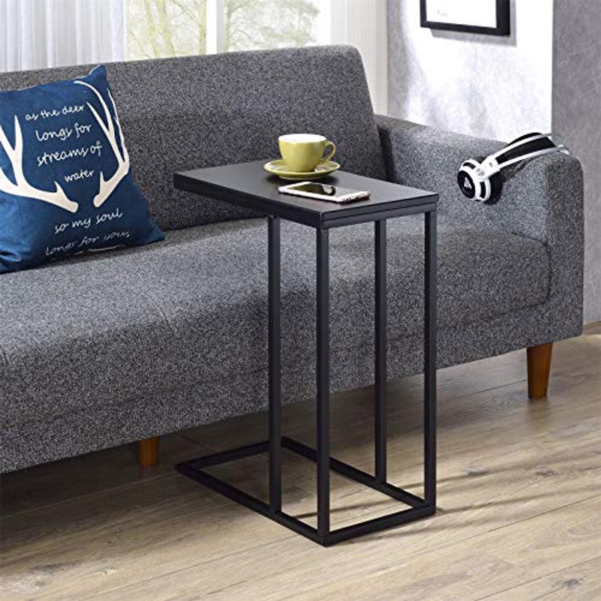 Elegante C-vormige salontafel met zwart metalen frame en rechthoekig tafelblad