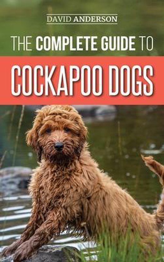 Boekomslag met een bruine cockapoo hond die in het water zit, met de tekst 'THE COMPLETE GUIDE TO COCKAPOO DOGS'.