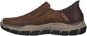 Bruine leren slip-on schoen met taupe zool en oranje 'Slip-ins' logo.