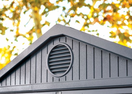 Grijze berging dak met ventilatierooster.
