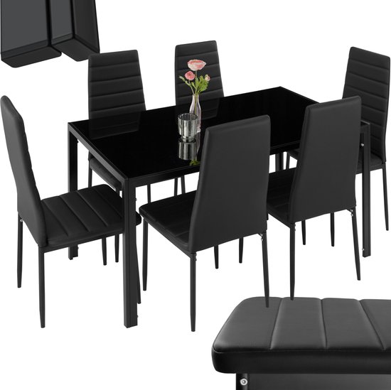 Zwarte eetkamerset met glazen tafel en zes stoelen met horizontale stiksels.