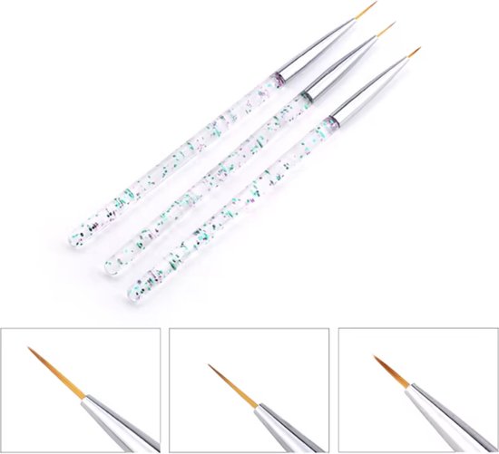 Drie nail art penselen met glinsterende handvatten en fijne gouden puntjes.