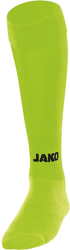 Une chaussette de sport vert citron mi-cuisse avec le logo JAKO en noir.