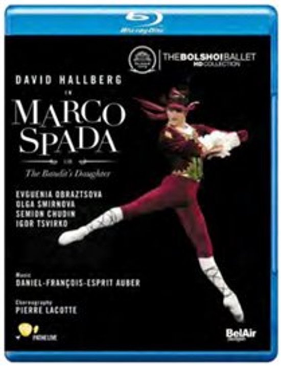 David Hallberg als Marco Spada, gekleed in een bordeauxrode panty en vest met gouden details en een rode hoed.