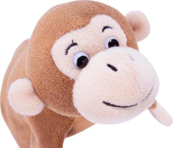 Marionnette singe marron avec museau clair et sourire brodé, regarde vers la gauche.