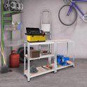 Twee AREBOS stellingkasten in een garage, één met een werkbankopstelling met gereedschap.